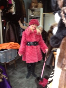 At the flea market in bubble gum pink fur and a matching dog. 