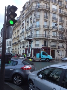 This is how people move in and out of centuries old buildings in Paris. Portable elevators!