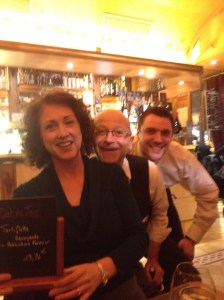 Joan with her "tortiflette" special and two happy waiters.