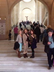 At the Louvre on the steps leading to the Winged Victory statue. 
