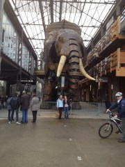 The elephant is powered by man and machine and you can ride him. It was amazing. It was made in Mantes in a former ship making building. 